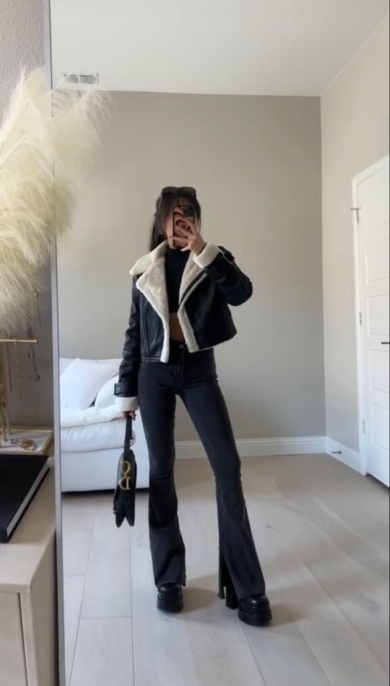 black flared jeans and black platform boots